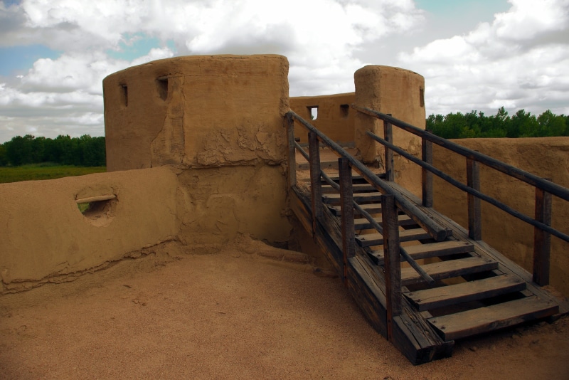 cloud - sky, wall, site, plant, connection, nature, viga, trading post, fort, trail, historic, land, fort william, sky, tower, bastion, bents, logs, colorado