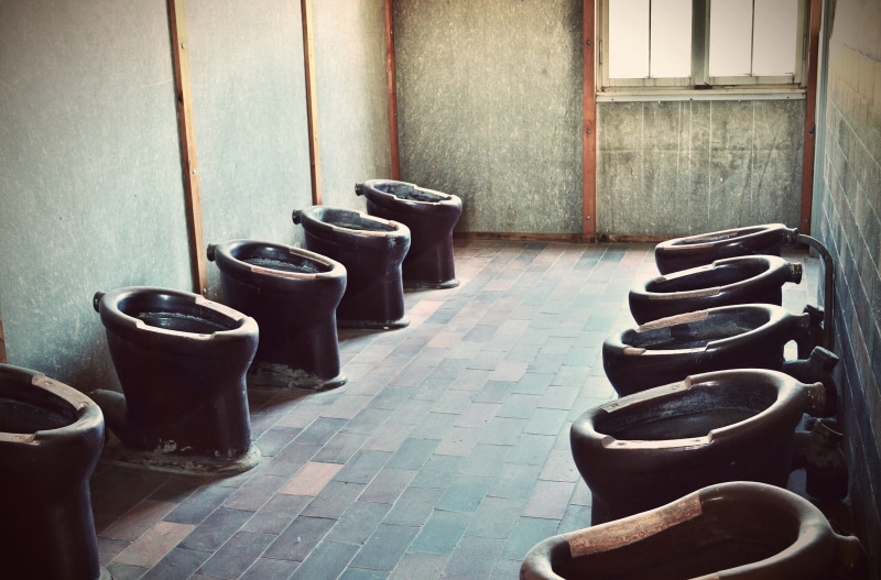 toilet, wall - building feature, tile, death, indoors, history, toilets, chair, bad, built structure, absence, kz, flooring, past, crime, architecture