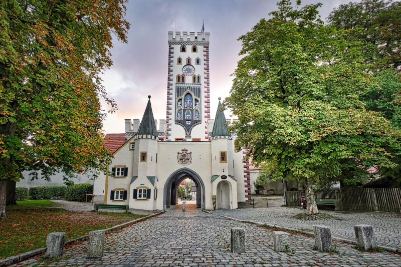 landmark, historic center, bayer gate, religion, tower, landsberg, building, belief, city, no people, sky, transit, city wall, paving stone, historically