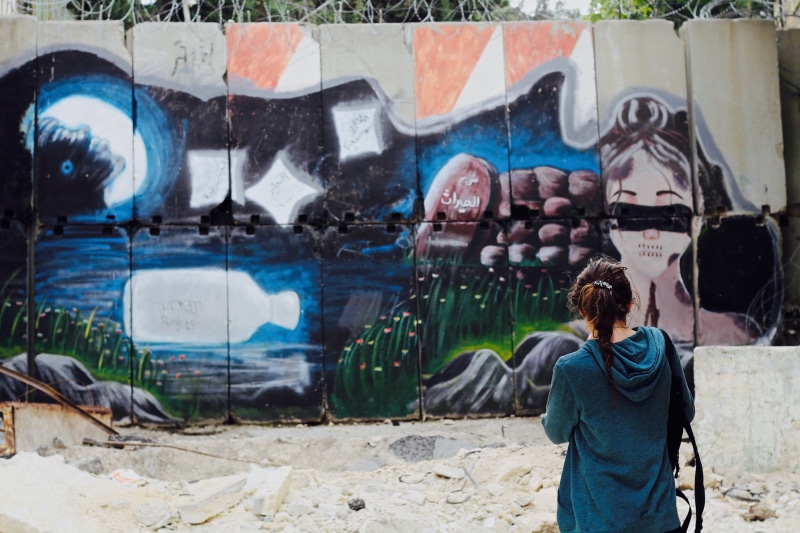 palestine, creativity, unsplash, built structure, art and craft, leisure activity, travelling, women, wall - building feature, real people, lifestyles
