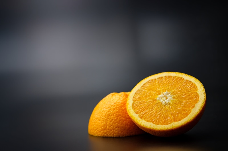 orange - fruit, food, orange color, antioxidant, eat, copy space, ripe, orange, 5K, vitamins, indoors, black background, still life, cross section
