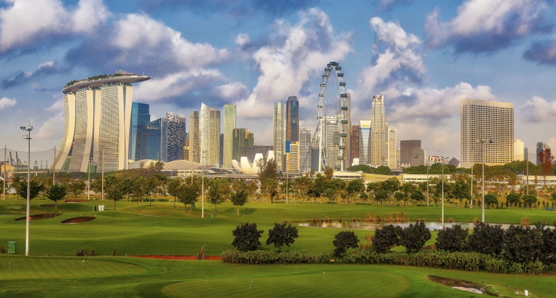 golf course, urban, sunset, buildings, grass, residential district, travel, tower, business, building exterior, clouds, facade, downtown, apartment, landmark