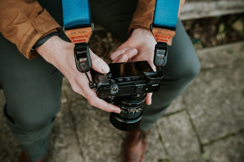teenager, camera - photographic equipment, photography themes, technology, strap, arts culture and entertainment, len, dslr, sitting, communication, camera