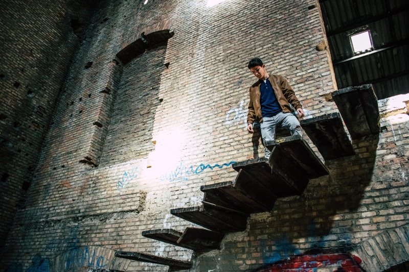 real people, wall, men, lifestyles, 5K, ruins, wall - building feature, young adult, leisure activity, clothes, casual clothing, one person, low angle view