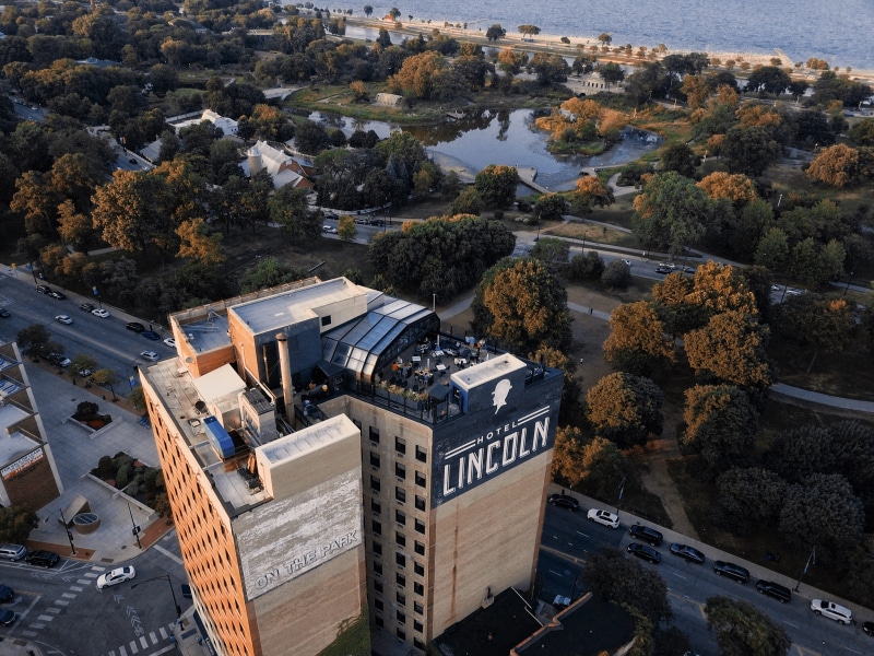 buildings, high angle view, road, aerial, plant, mode of transportation, growth, day, photgraphy, architecture, transportation, nature, car, text, built structure