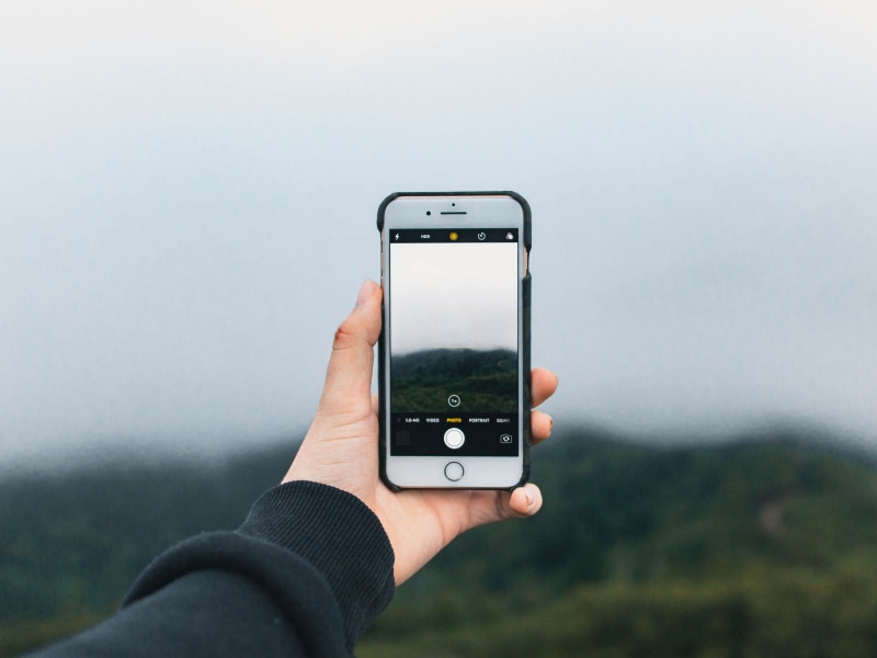 technology, portrait, lcd screen, mobile phone, finger, photgraphy, trees, connection, nature, human body part, cell phone, human, human hand, arm, screen