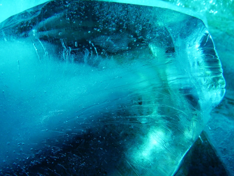 human body part, cold temperature, structure, undersea, day, ice, transparent, water, reflection, turquoise, bubble, dark, motion, shadow, no people, close-up