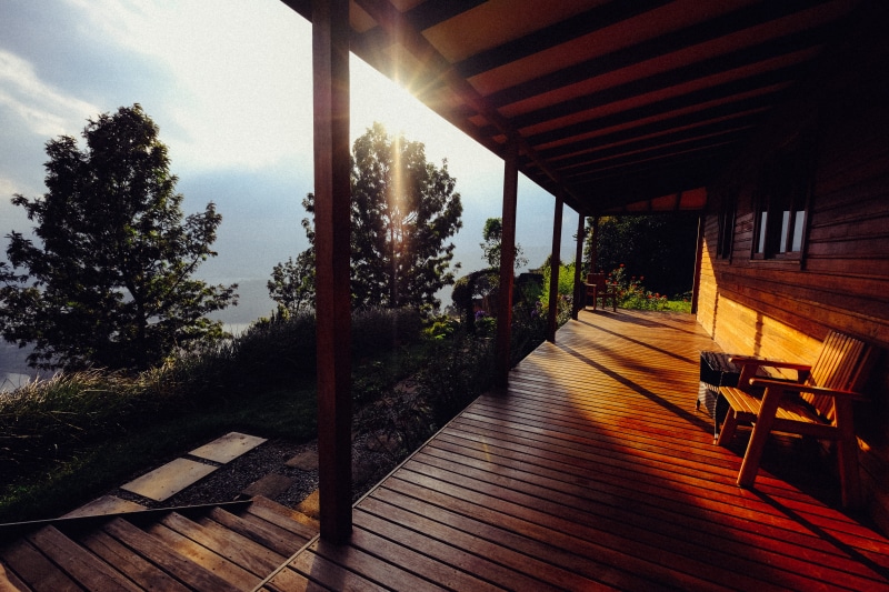 empty, indoors, seat, sunlight, day, sunset, architectural column, sky, no people, porch, nature, wood, architecture, tree, ray, chalet, 5K, absence, growth