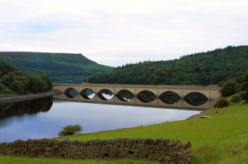 beauty in nature, mountain, calm, day, reflections, peak, snake pass, nature, green color, tree, no people, arch, landscape, bridge - man made structure