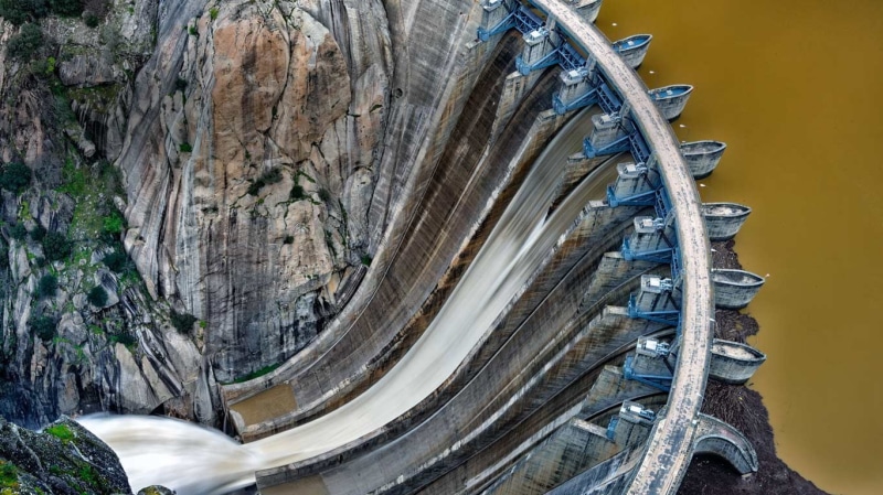 river, day, formation, water, rock - object, transportation, mountain, land vehicle, rock, nature, rock formation, yellow, solid, high angle view, outdoors