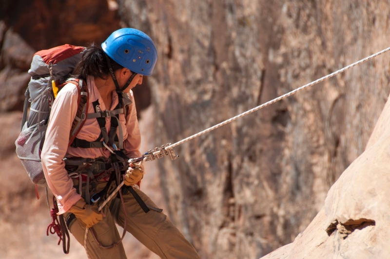 communication, abseiling, headwear, cliff, wearing, woman, rock, canyoneering, 1080P, sports helmet, protection, climbing equipment, usa, harness, one person