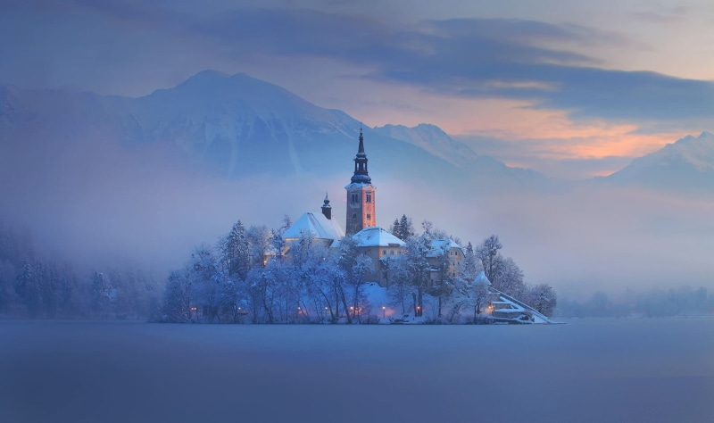 belief, built structure, sky, tree, no people, concrete, brown, place of worship, snowcapped mountain, nature, spire, Lake Bled, snow, winter, mountain