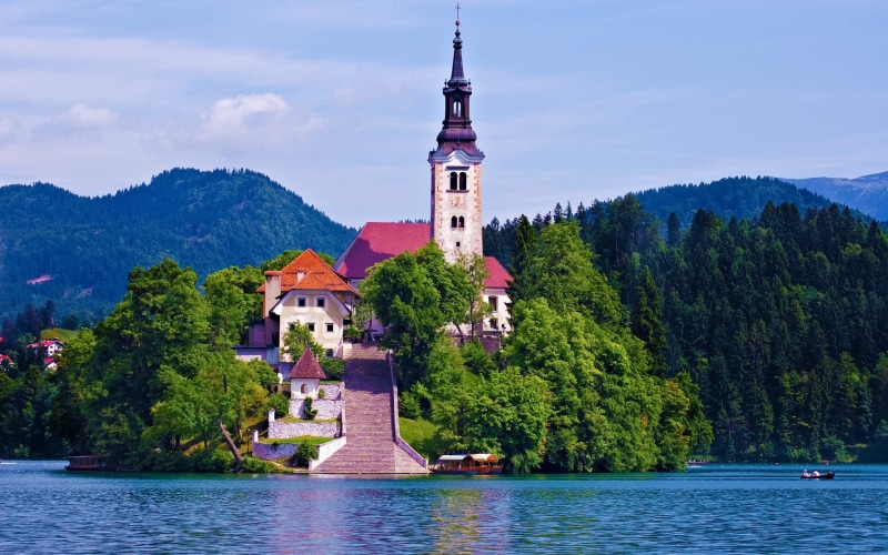 tree, spire, religion, built structure, travel destinations, building, palace, island, Lake Bled, belief, building exterior, architecture, place of worship