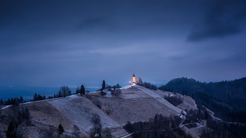 evening, tourism, mountain, cloud - sky, outdoors, Slovenia, spire, clouds, church, forest, dusk, building exterior, trees, ancient, no people, tower, scenics - nature
