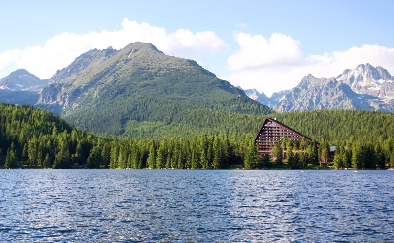 mountain peak, near, tranquility, forest, architecture, beauty in nature, lake, mountains, sky, calm, day, tree, summer, 2K, mountain range, outdoors