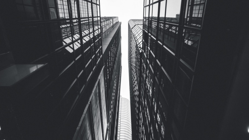 the way forward, gloomy, bridge, directly below, tall - high, cityscape, architecture, building exterior, bw, monotone, symmetry, dirt, building, art, buildings