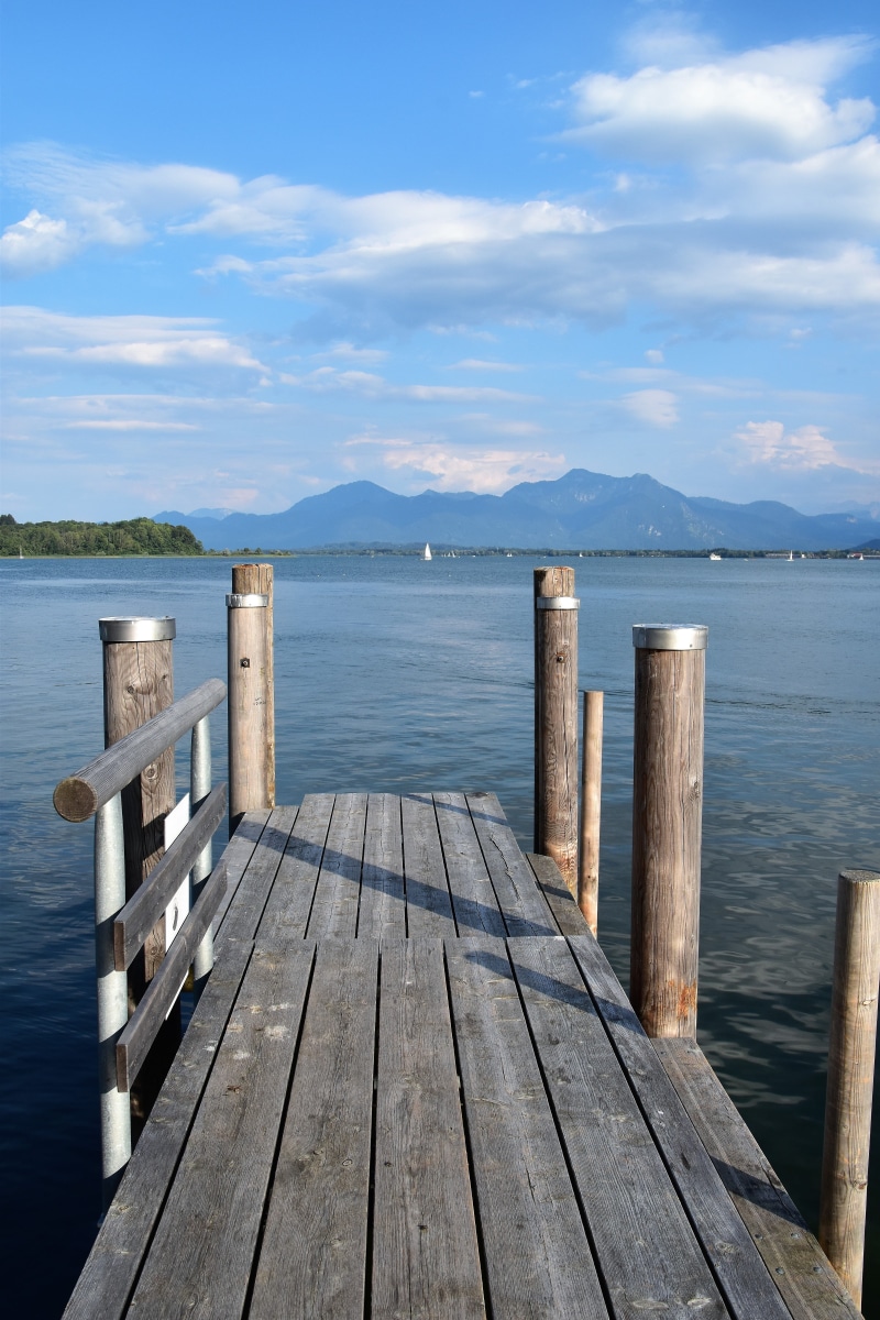 bridge, tranquil scene, prien chiemsee, structure, summer, texture, direction, dock, wood, cloud - sky, building, lake, outdoors, germany, post, water