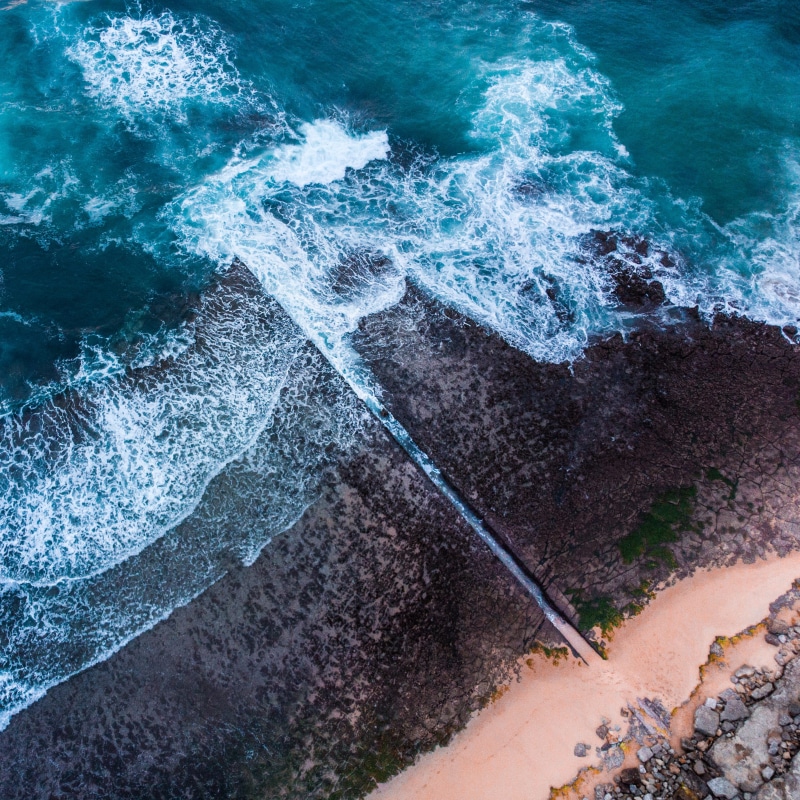 hitting, bird, power in nature, flowing water, high angle view, rock - object, splashing, discover, water, outdoor, breaking, coastline, sea, beauty in nature