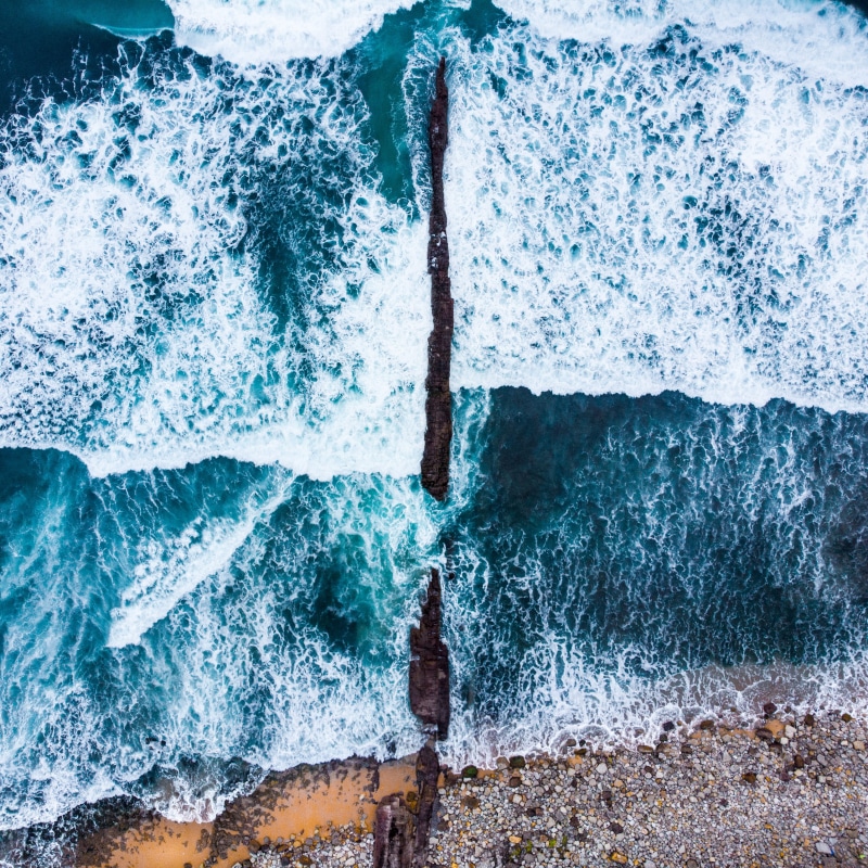 sand, nature, breaking, sea, aerial, cold, rock - object, drone, purity, pier, beauty in nature, aerial view, drone view, travelling, cool, blurred motion