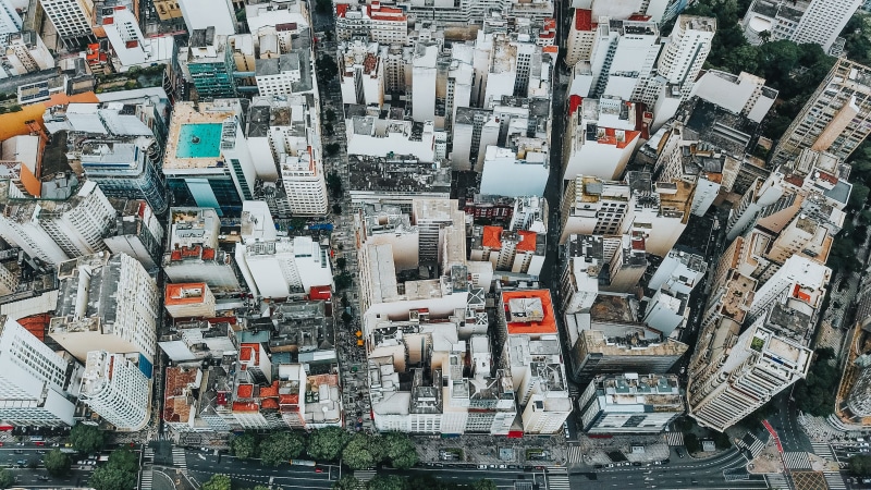 nature, office building exterior, crowded, large group of objects, neighborhood, scenery, urban, cityscape, landscape, skyscraper, yard, condo, areal, road