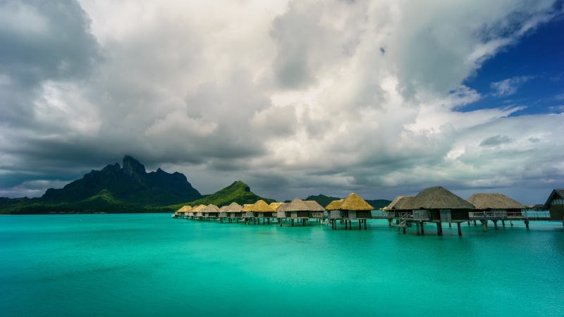 promontory, land, island, bungalow, cloud - sky, bungalows, tranquility, 4K, turquoise colored, tranquil scene, ocean, thatched roof, lagoon, mount otemanu