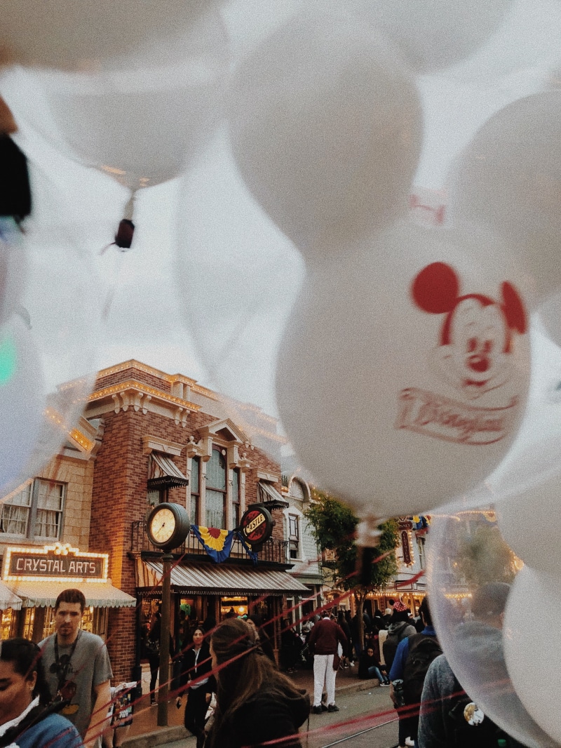 disney, built structure, human representation, lifestyles, building exterior, group of people, city, disneyland, disneyland park, ballons, representation