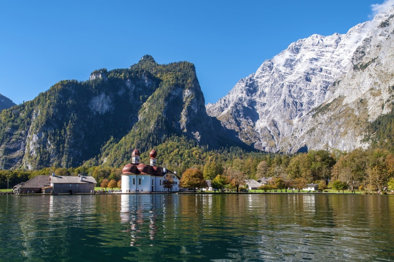 building exterior, beauty in nature, 2K, berchtesgaden, kings lake, nature, mountain, clear sky, koenigssee, lake, two people, outdoors, waterfront, architecture