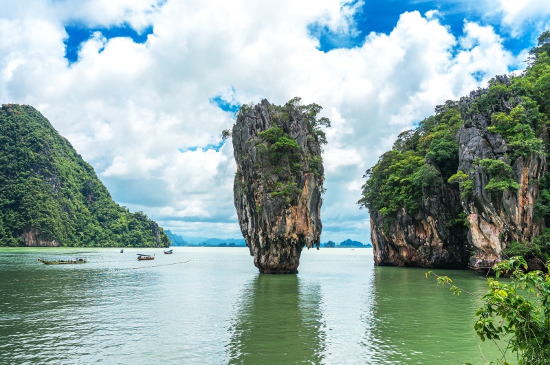 beauty in nature, bay, surrounded, mountain, travel, tranquil scene, sea, rock - object, natural, asia, phang nga bay, water, sky, body, landmark, lagoon