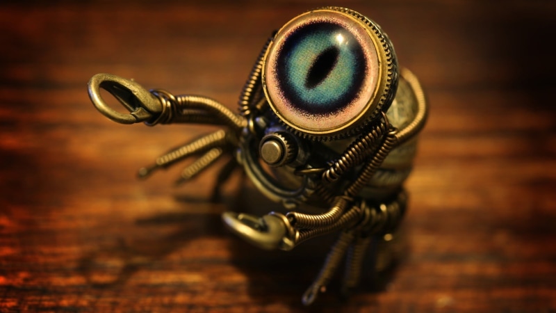 decor, robot, insect, focus on foreground, table, single object, studio shot, artwork, indoors, no people, photography themes, brass, technology, metal