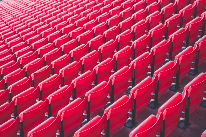 soccer, bleachers, seats, large group of objects, football, chair, repetition, order, public, plastic chair, no people, sport, absence, audience, red, auditorium