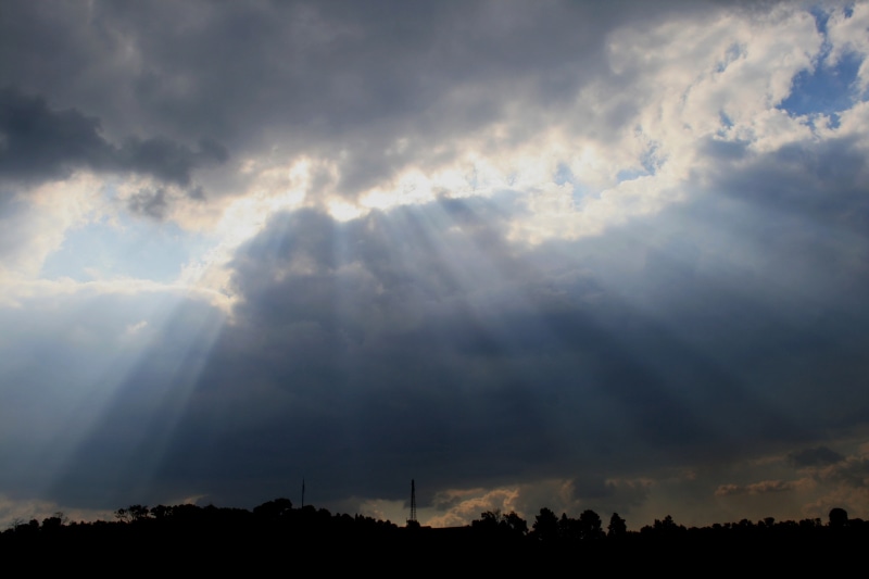 storm, idyllic, weather, outdoors, silhouette, tree, streaming, clouds, sunbeam, landscape, environment, sunset, sunbeams, sky, dark horizon, cloud - sky
