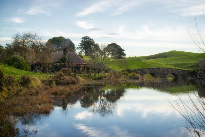 beauty in nature, bridge, cloud - sky, water, nature, 5K, trees, plant, nz, day, non-urban scene, sky, hobbiton, tranquil scene, tree, tranquility, no people