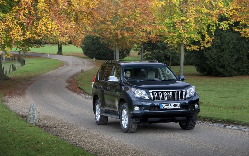 prado, mode of transportation, suv, nature, motor vehicle, land, machine, direction, day, plant, tree, street, the way forward, car, autumn, field, land vehicle