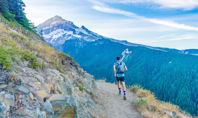 outdoor, running, sky, full length, nature, scenics - nature, clear, trailrunning, exercising, edge, mountain range, forest, backpack, fitness, cliff, sport