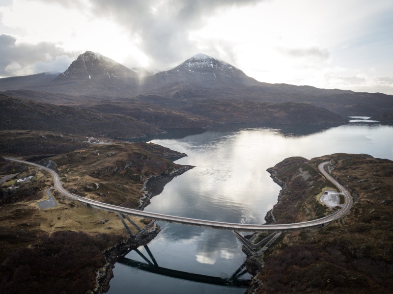 tranquil scene, non-urban scene, travel destinations, capped, reflection, road, 4K, high angle view, mountains, landscape, mountain range, drone, near