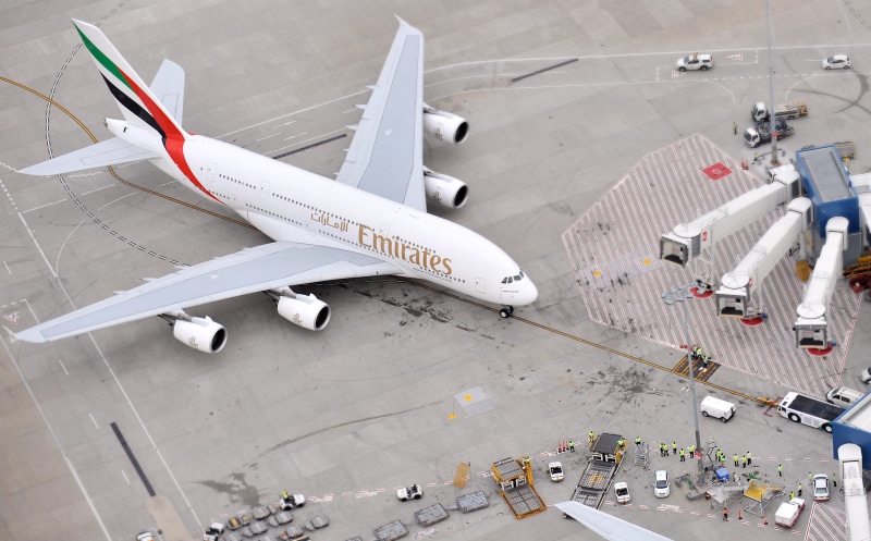mode of transportation, land vehicle, standing, A380, airport runway, incidental people, Passenger, airplane, Airliner, road, real people, aerospace industry
