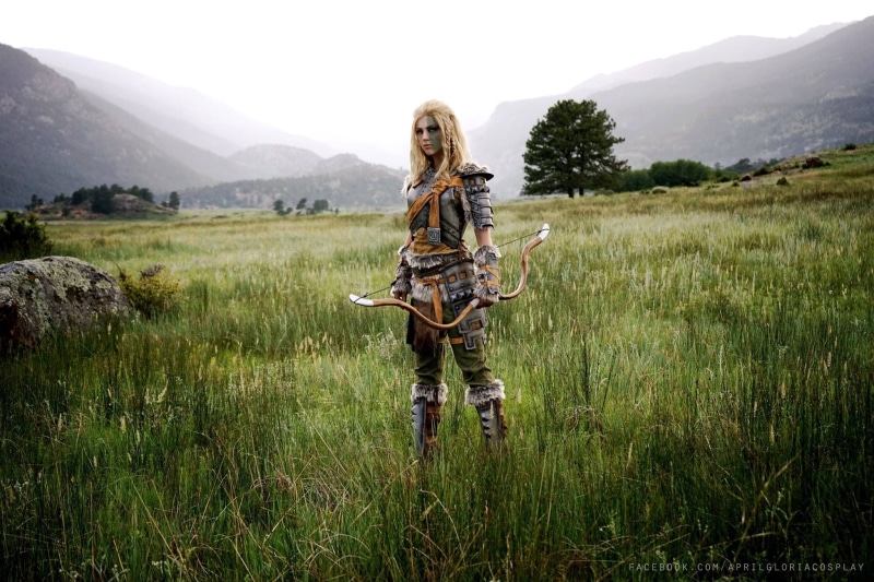 women, cosplay, 1080P, Mjoll the Lioness (Skyrim), pigtails, standing, long hair, blonde, looking at viewer, bow, The Elder Scrolls V: Skyrim, outdoors