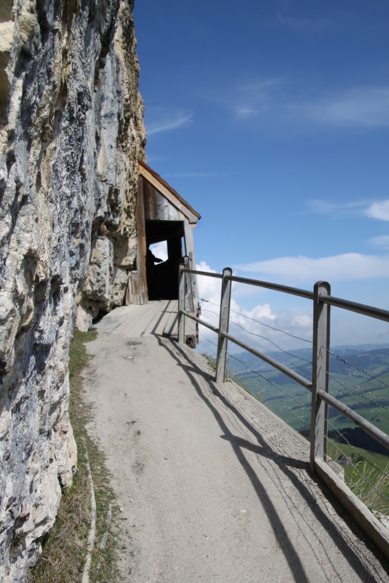 mountain station, switzerland, building exterior, nature, steep wall, day, sea, non-urban scene, restaurant, built structure, away, architecture, railing