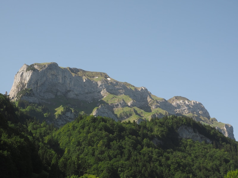 sky, rock - object, environment, land, day, formation, mountain peak, beauty in nature, blue, rock, tranquil scene, no people, clear sky, nature, mountain range