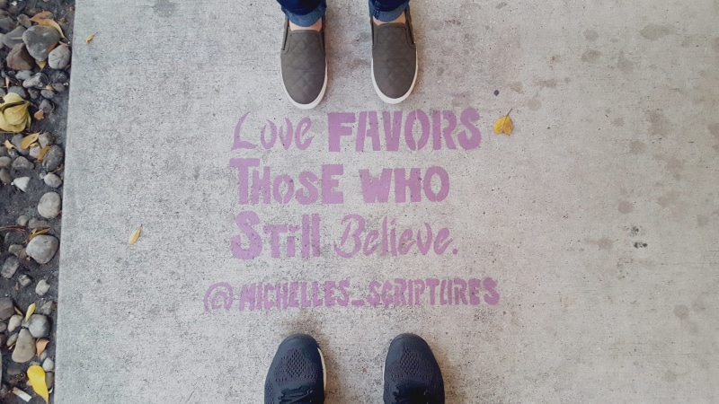 outdoors, believe, sign, one person, lover, stencil art, shoe, feet, personal perspective, floor, pavement, communication, footwear, text, message, love