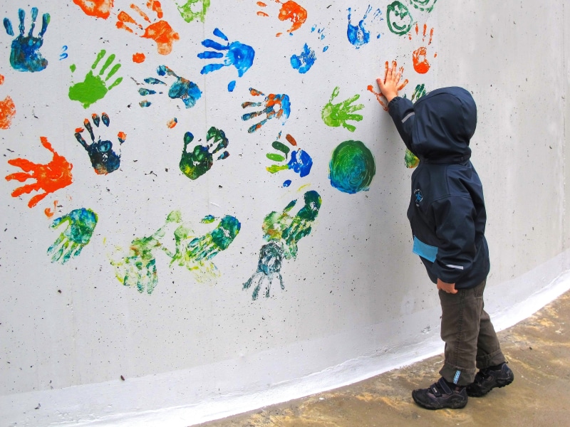 beside, human, contour, human arm, standing, finger, dirty, built structure, art and craft, lifestyles, rain clothing, leisure activity, Hand, out, one person