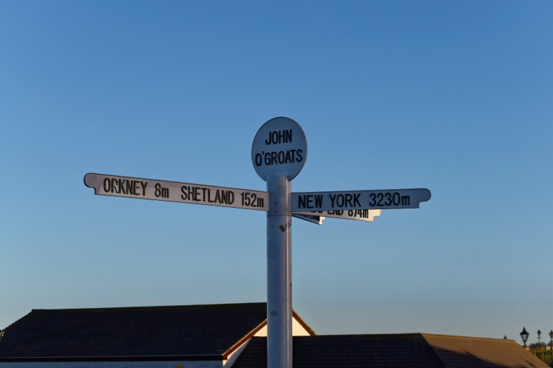 signpost, landmark, road, information sign, north, sea, 5K, headland, kingdom, orkney, sky, communication, place, text, sign, information, lands end, coastline