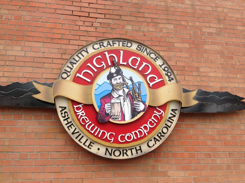 alcohol, representation, glass, architecture, stout, ale, built structure, drinking, liquor, menu, human representation, information sign, brick, wall - building feature