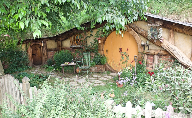 new zealand, mata mata, picket, no people, chair, flower, outdoors, wood - material, built structure, patio, front or back yard, tree, garden, cottage