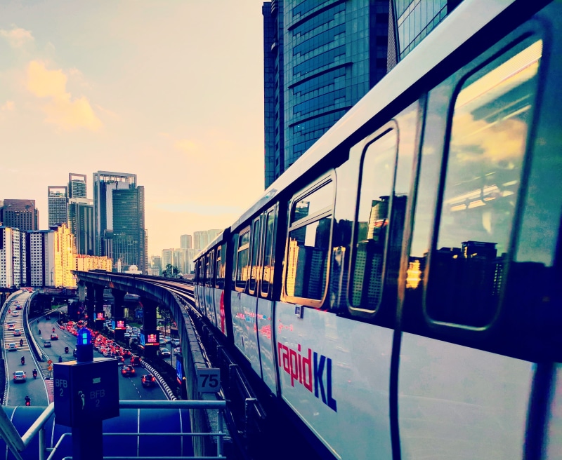 public transportation, city, subway train, no people, outdoors, rail transportation, speed, built structure, 2K, cloud - sky, evening, rapid kl, mode of transportation
