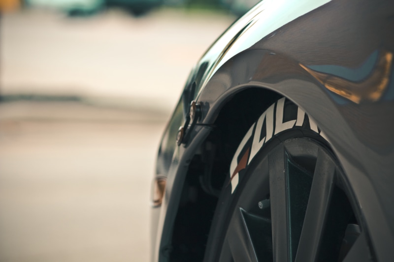 outdoors, metal, tire, drift, road, black color, day, mode of transportation, wheel, selective focus, tires, transportation, grand rapids, close-up, nature