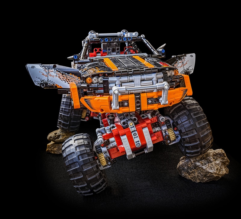 wheel, transportation, suspension, orange color, off-roader, isolated, studio shot, road construction, land vehicle, toys, tire, monster, background, background image