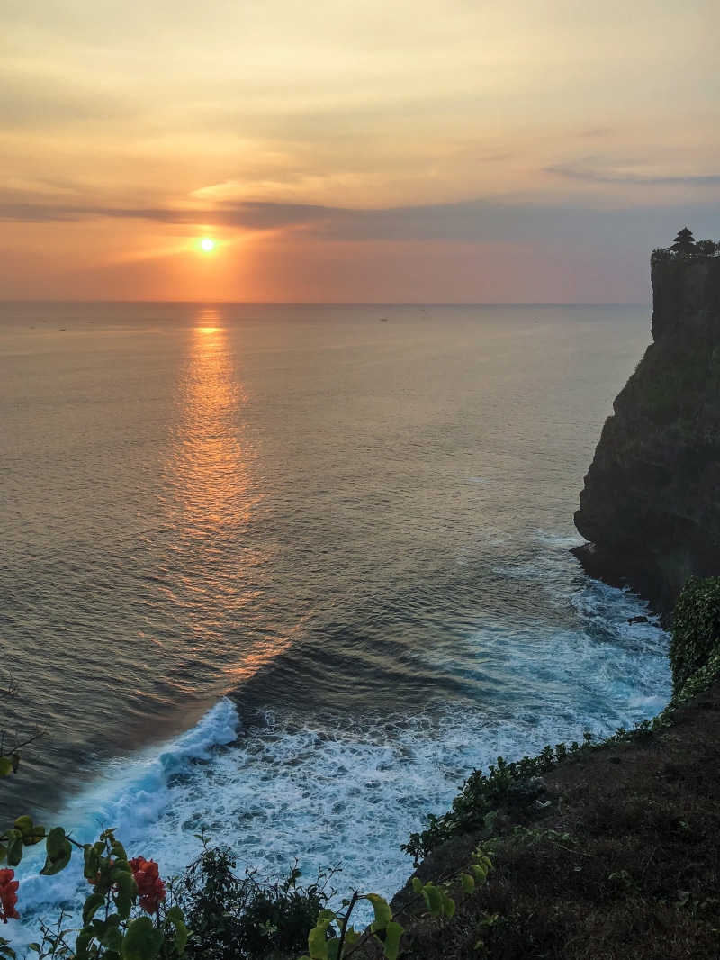beach, land, orange color, horizon over water, motion, rock, cloud - sky, scenics - nature, cliffs, uluwatu temple, horizon, sea, tranquility, indonesia