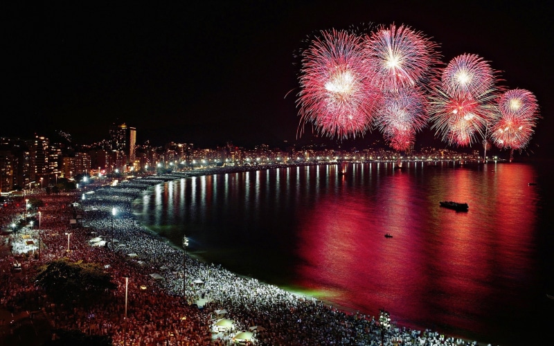 nature, event, coast, city, no people, arts culture and entertainment, illuminated, built structure, night, firework - man made object, crowds, assorted
