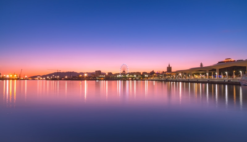 night, pink color, building exterior, twilight, outdoors, reflection, travel destinations, sunset, ocean, docks, architecture, málaga, muelle uno